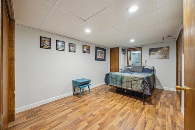 603 2nd Ave NW, Buffalo, MN 55313 - bedroom with wood finished floors, baseboards, a paneled ceiling, and recessed lighting