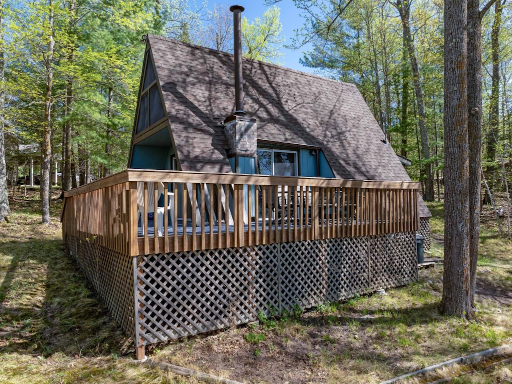 35253 Johnson Lake Rd, Deer River, MN 56636 - rear view of house with roof with shingles and a deck