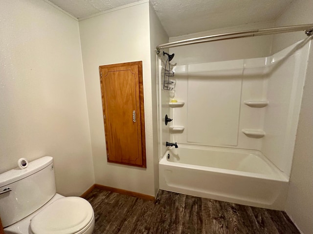 210 160th Ave, Osborne Twp, MN 56128 - bathroom featuring wood finished floors, toilet, a textured ceiling, baseboards, and  shower combination