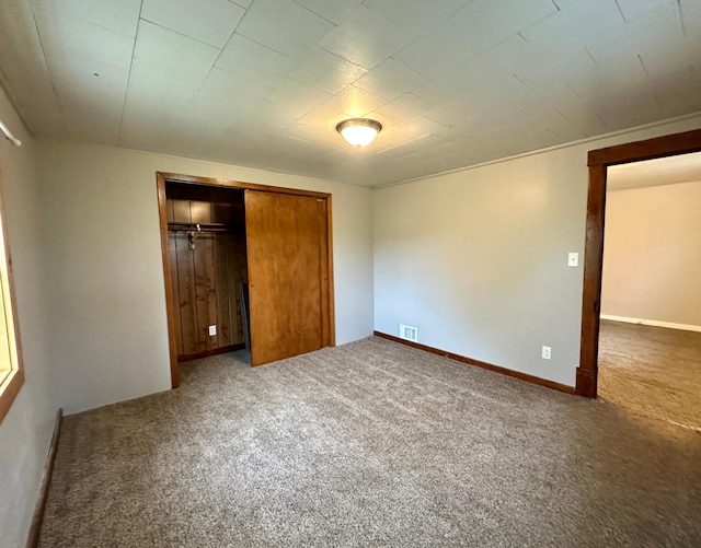 210 160th Ave, Osborne Twp, MN 56128 - unfurnished bedroom featuring carpet and a closet
