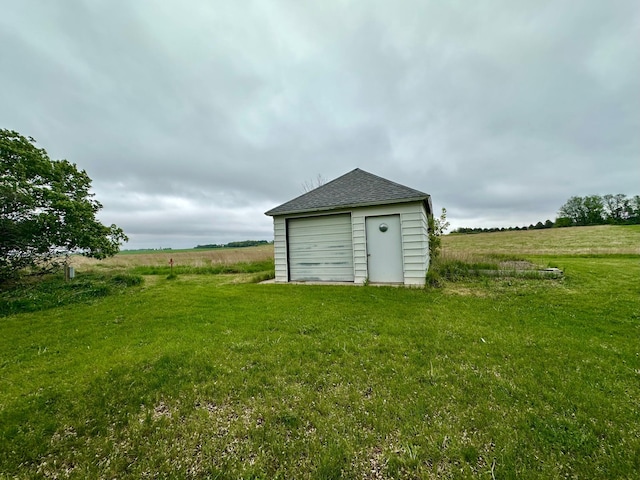 210 160th Ave, Osborne Twp, MN 56128 - view of grassy yard with an outdoor structure, a shed, and a view of rural / pastoral area