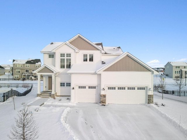 11781 34th St N, Lake Elmo, MN 55042 - view of front of home with stone siding and board and batten siding