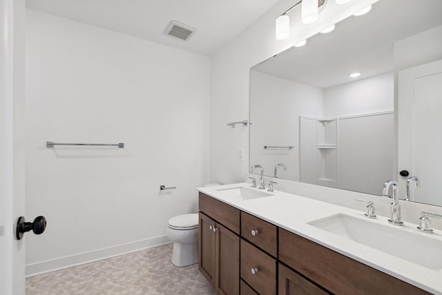 11781 34th St N, Lake Elmo, MN 55042 - full bathroom featuring tile patterned floors, toilet, double vanity, and baseboards