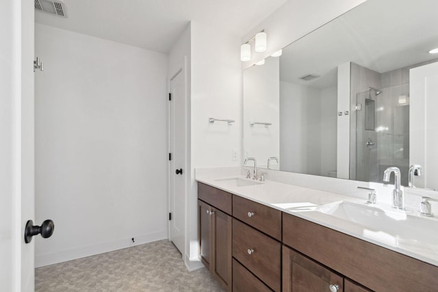 11781 34th St N, Lake Elmo, MN 55042 - full bath with tile patterned floors, a shower stall, double vanity, and baseboards