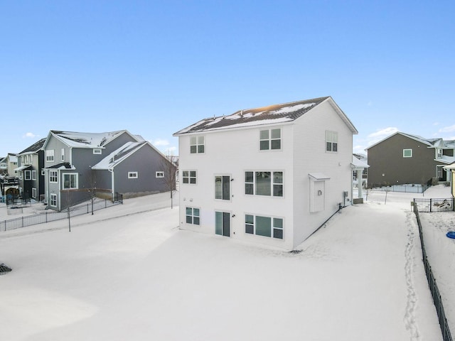 11781 34th St N, Lake Elmo, MN 55042 - snow covered house featuring fence and a residential view