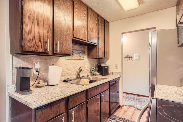 255 Westview Dr Unit 305, West Saint Paul, MN 55118 - kitchen with dishwasher, light wood-type flooring, light countertops, backsplash, and range with electric cooktop