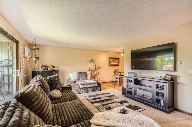 255 Westview Dr Unit 305, West Saint Paul, MN 55118 - living room featuring ceiling fan, an AC wall unit, and a textured ceiling