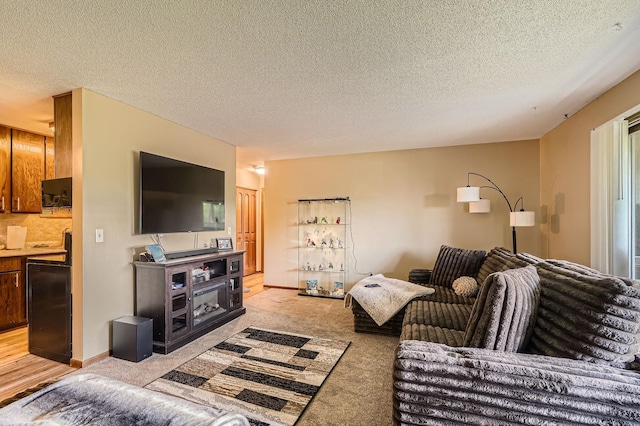 255 Westview Dr Unit 305, West Saint Paul, MN 55118 - living room featuring light carpet and a textured ceiling