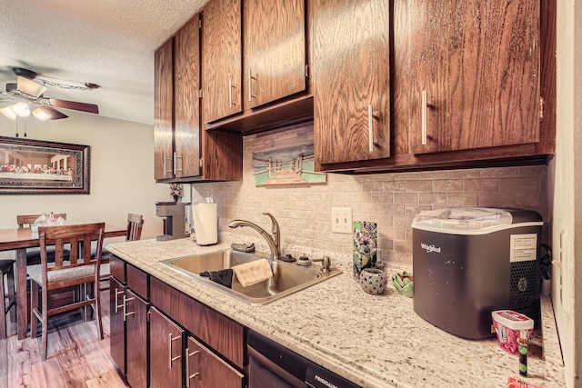 255 Westview Dr Unit 305, West Saint Paul, MN 55118 - kitchen with ceiling fan, tasteful backsplash, a textured ceiling, light wood-style floors, and dishwashing machine