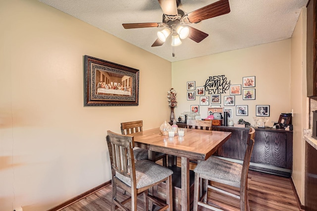 255 Westview Dr Unit 305, West Saint Paul, MN 55118 - dining area with wood finished floors, a ceiling fan, and a textured ceiling