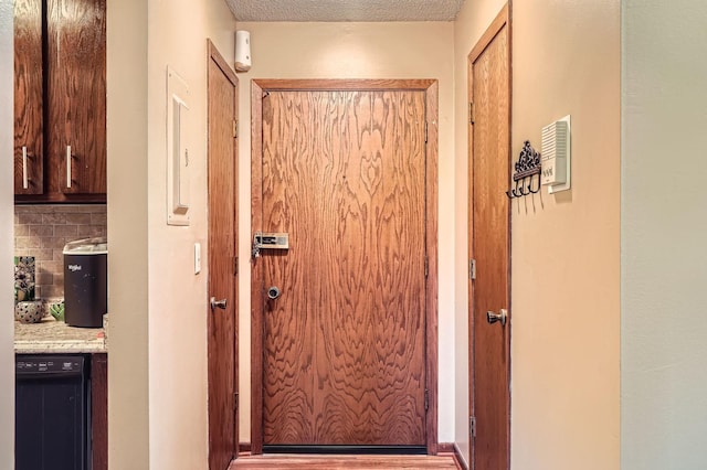 255 Westview Dr Unit 305, West Saint Paul, MN 55118 - doorway featuring wood finished floors and a textured ceiling