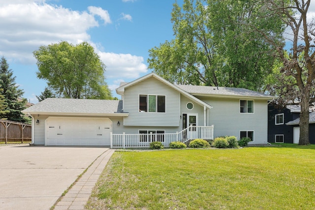 1650 132nd Ave NW, Coon Rapids, MN 55448 - view of front of house with concrete driveway and a garage