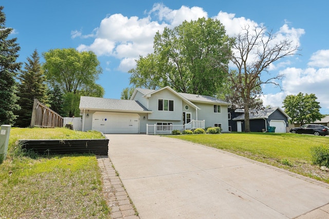 1650 132nd Ave NW, Coon Rapids, MN 55448 - view of front facade featuring an attached garage and concrete driveway