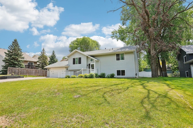 1650 132nd Ave NW, Coon Rapids, MN 55448 - back of property featuring a garage and concrete driveway