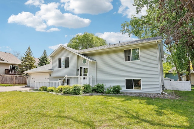 1650 132nd Ave NW, Coon Rapids, MN 55448 - back of house with concrete driveway and an attached garage