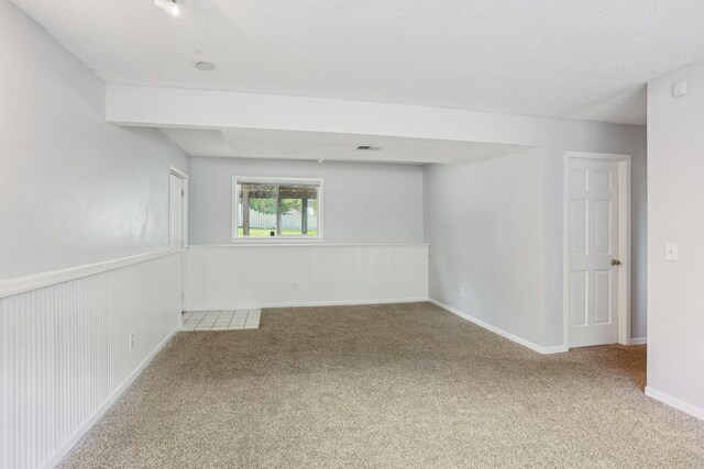 1650 132nd Ave NW, Coon Rapids, MN 55448 - unfurnished room with carpet floors and a textured ceiling