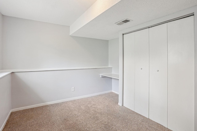 1650 132nd Ave NW, Coon Rapids, MN 55448 - unfurnished bedroom featuring carpet flooring, a closet, and baseboards