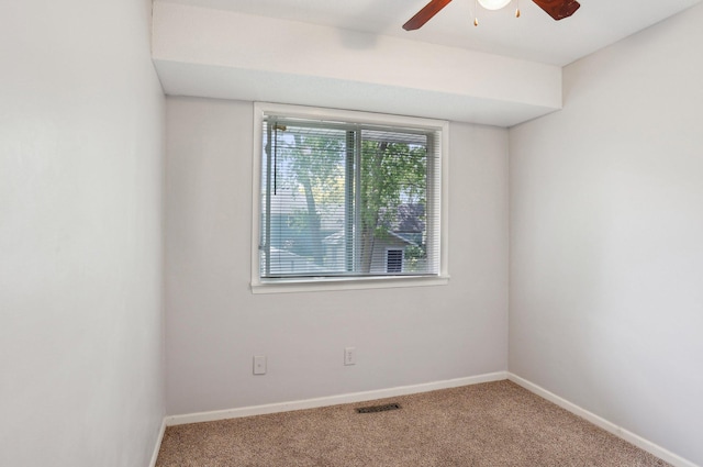 1650 132nd Ave NW, Coon Rapids, MN 55448 - empty room with a ceiling fan, carpet, and baseboards