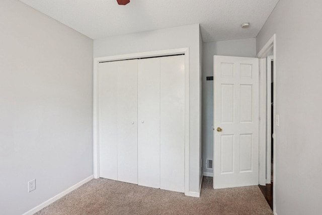 1650 132nd Ave NW, Coon Rapids, MN 55448 - unfurnished bedroom featuring carpet floors, a closet, and baseboards