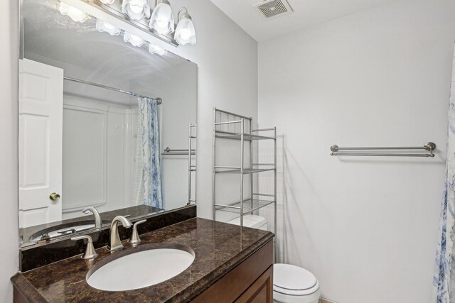 1650 132nd Ave NW, Coon Rapids, MN 55448 - bathroom with vanity, toilet, and a shower with curtain