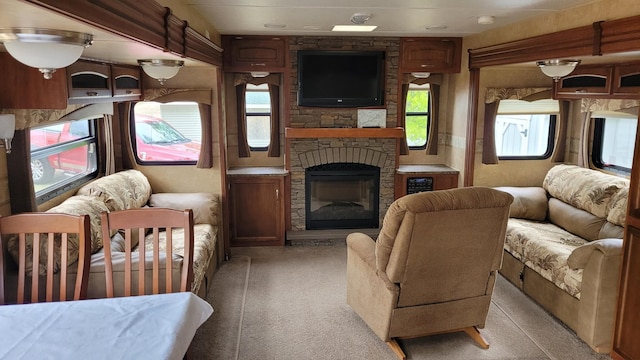 1101 Big Portage Lake Dr NW, Backus, MN 56435 - living area featuring light colored carpet and a stone fireplace
