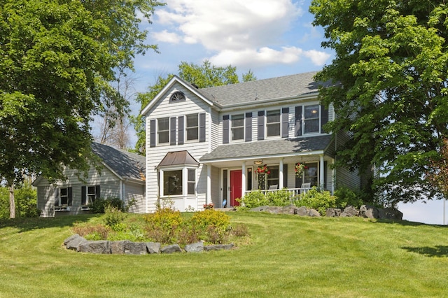 6185 Partridge Ct, Lino Lakes, MN 55110 - traditional home featuring a porch, a front yard, and a shingled roof