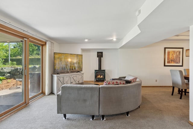 6185 Partridge Ct, Lino Lakes, MN 55110 - carpeted living area with a wood stove and baseboards