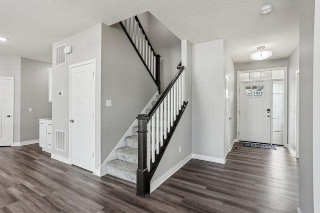 18378 Grasshopper Dr, Lakeville, MN 55044 - foyer with dark wood-style flooring, baseboards, and stairway