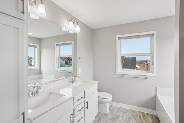 18378 Grasshopper Dr, Lakeville, MN 55044 - full bath featuring a bath, baseboards, marble finish floors, and healthy amount of natural light