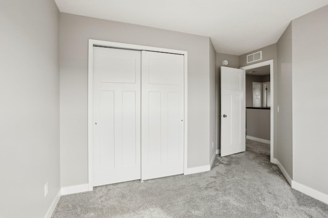 18378 Grasshopper Dr, Lakeville, MN 55044 - unfurnished bedroom featuring light colored carpet, baseboards, and a closet