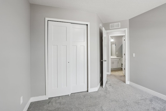 18378 Grasshopper Dr, Lakeville, MN 55044 - unfurnished bedroom with light colored carpet, baseboards, and a closet