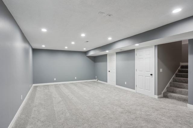 18378 Grasshopper Dr, Lakeville, MN 55044 - finished below grade area with recessed lighting, carpet flooring, baseboards, and stairs