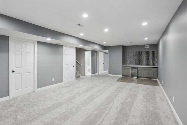 18378 Grasshopper Dr, Lakeville, MN 55044 - finished basement featuring carpet flooring, wine cooler, recessed lighting, baseboards, and stairway