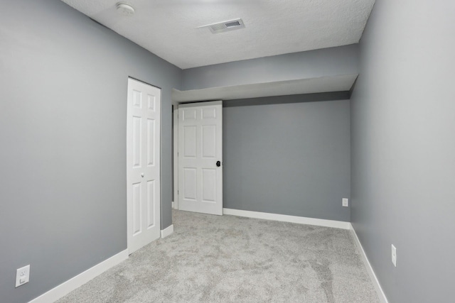 18378 Grasshopper Dr, Lakeville, MN 55044 - unfurnished bedroom featuring carpet flooring, baseboards, a textured ceiling, and a closet