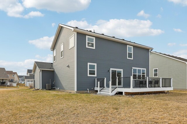 18378 Grasshopper Dr, Lakeville, MN 55044 - back of property featuring a wooden deck, a lawn, and central air condition unit