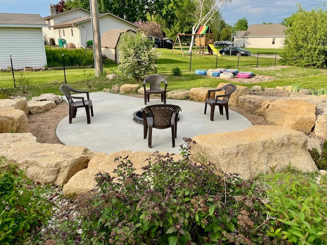 729 10th St E, Wabasha, MN 55981 - view of patio featuring a playground and a fire pit