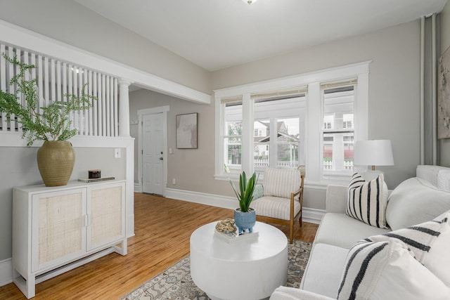 living area featuring wood finished floors and baseboards