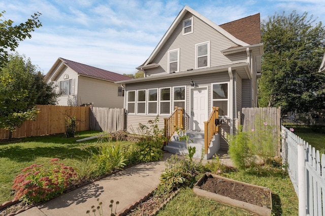 view of front of home with a garden