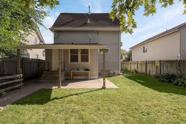 rear view of property featuring a patio and roof with shingles