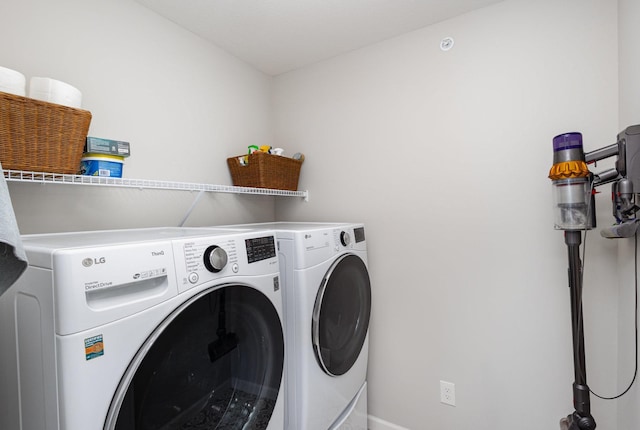 4892 Avery Ct, Eagan, MN 55123 - washroom featuring washing machine and clothes dryer and baseboards