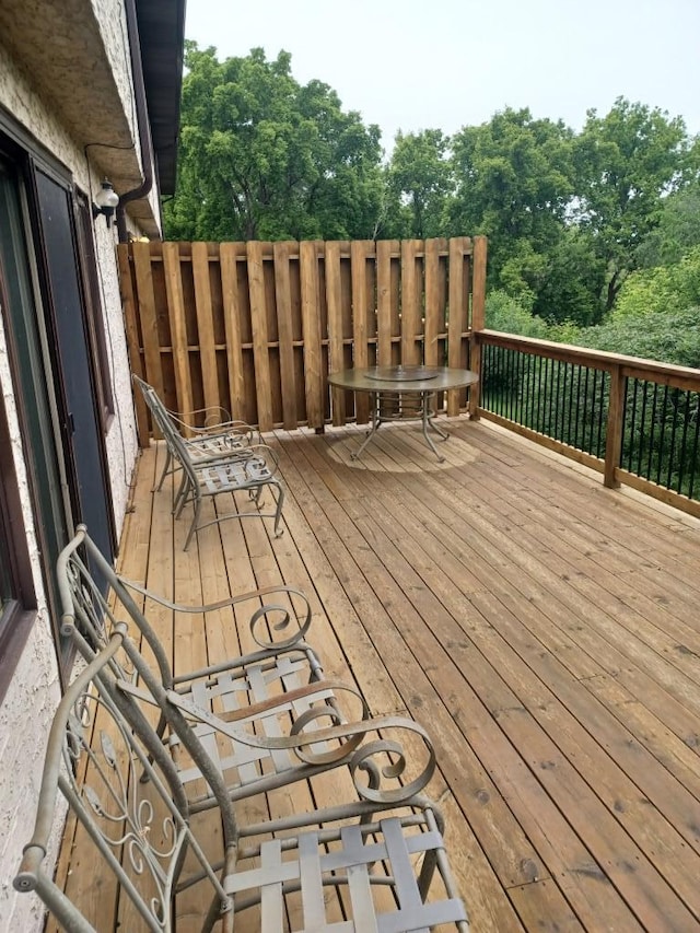 149 Riverview Dr Unit 5, Monticello, MN 55362 - wooden deck with view of scattered trees