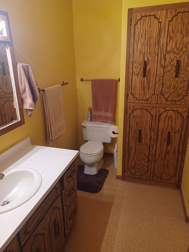 149 Riverview Dr Unit 5, Monticello, MN 55362 - bathroom featuring vanity, toilet, and baseboards