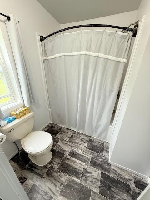 bathroom featuring toilet