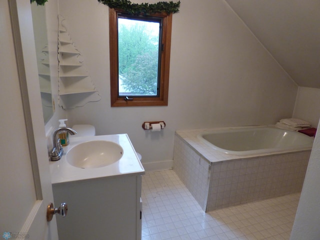 423 9th St N, Wahpeton, ND 58075 - bathroom featuring vanity, a garden tub, baseboards, and lofted ceiling
