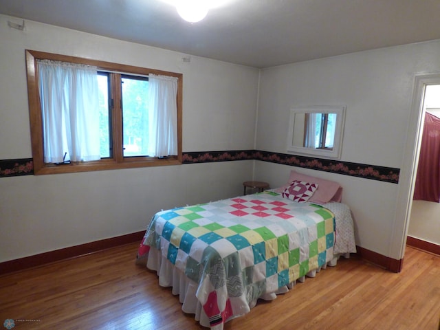 423 9th St N, Wahpeton, ND 58075 - bedroom with light wood-type flooring and baseboards
