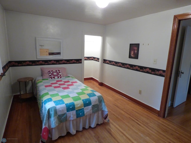 423 9th St N, Wahpeton, ND 58075 - bedroom with wood finished floors and baseboards