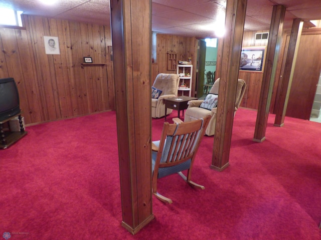 423 9th St N, Wahpeton, ND 58075 - basement featuring carpet floors, wood walls, and a drop ceiling
