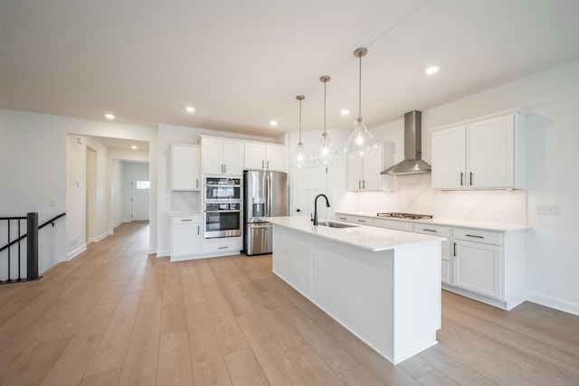 11405 Fieldstone Dr, Rogers, MN 55311 - kitchen with stainless steel appliances, wall chimney exhaust hood, a sink, white cabinets, and light countertops