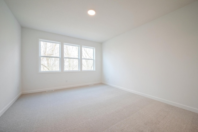 11405 Fieldstone Dr, Rogers, MN 55311 - spare room featuring light colored carpet, baseboards, and recessed lighting