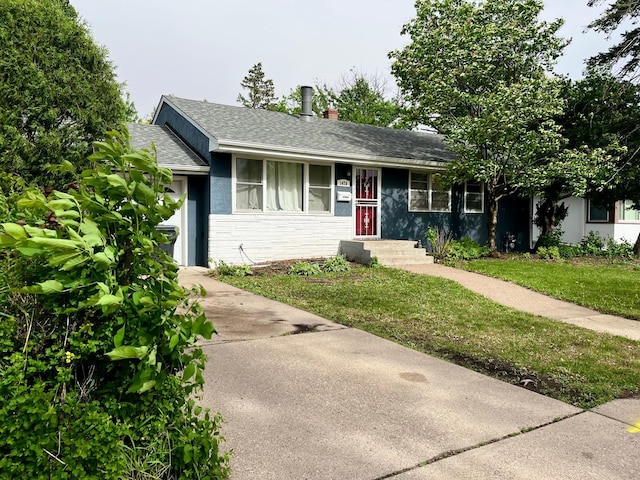1478 Birmingham St, Saint Paul, MN 55106 - ranch-style house with roof with shingles, concrete driveway, a front yard, stucco siding, and stone siding